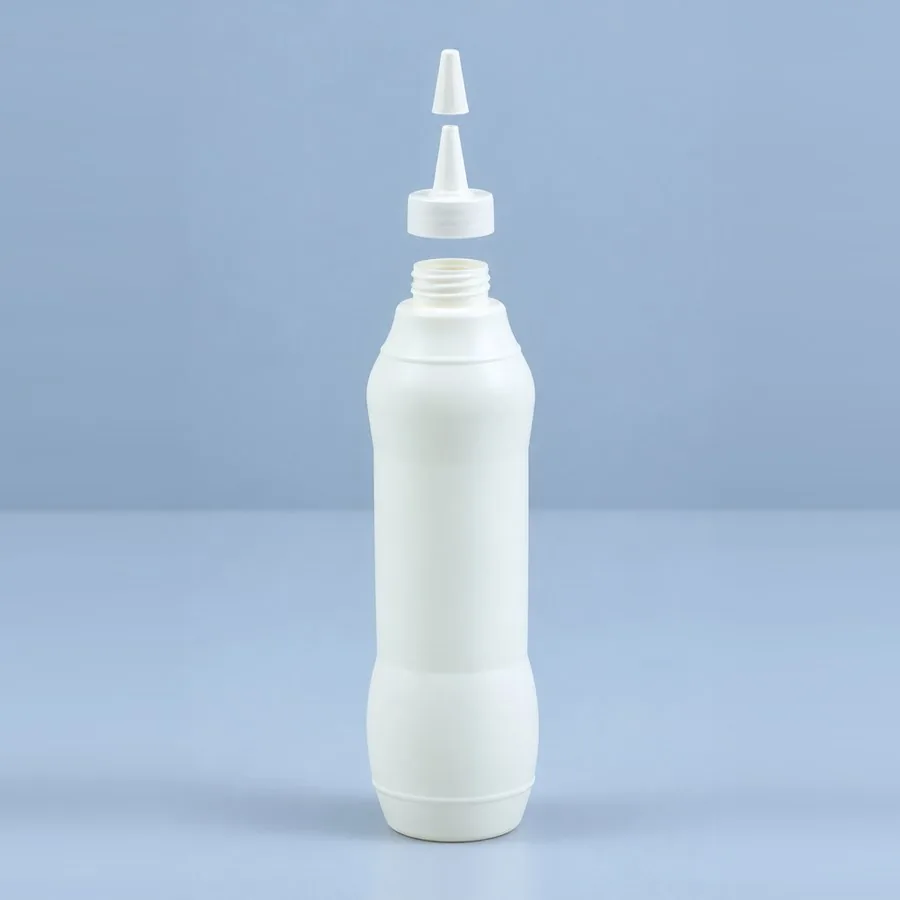 White 975 ml plastic topping sauce bottle with removable pointed nozzle cap, by Majid Industries