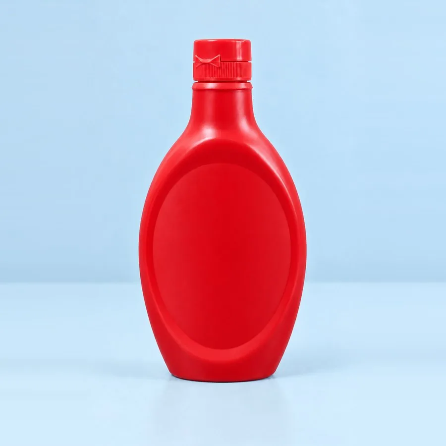 Red plastic topping sauce squeeze bottle with screw cap, by Majid Industries