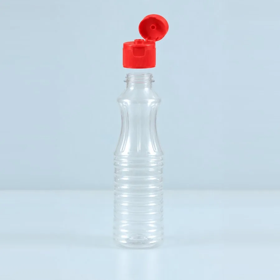 Clear 275 ml PET bottle with ribbed body and red flip-top cap open, Trio Pack Series by Majid Industries