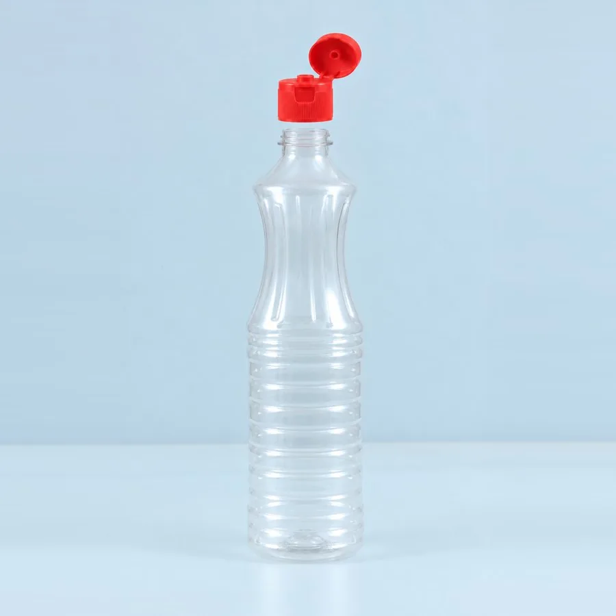 Clear 700 ml PET bottle with ribbed body and red flip-top cap open, Trio Pack Series by Majid Industries